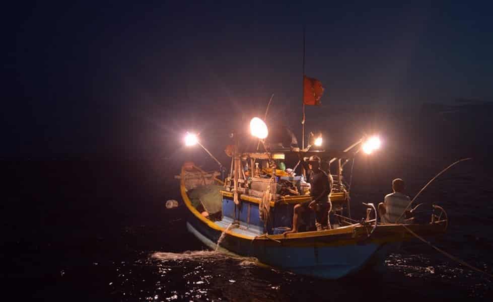 Night squid fishing boat on Ha Long Bay